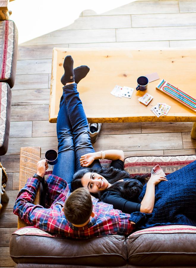 Couple Relax In A Cabin At Treeland Resort In Hayward