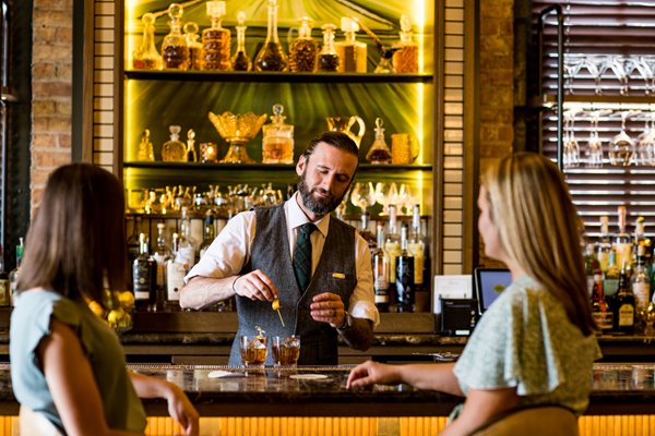 women enjoying craft cocktails at the harvey house in madison