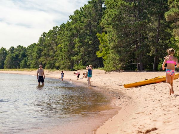 Family Enjoying the Beach at Big Bay Town Park